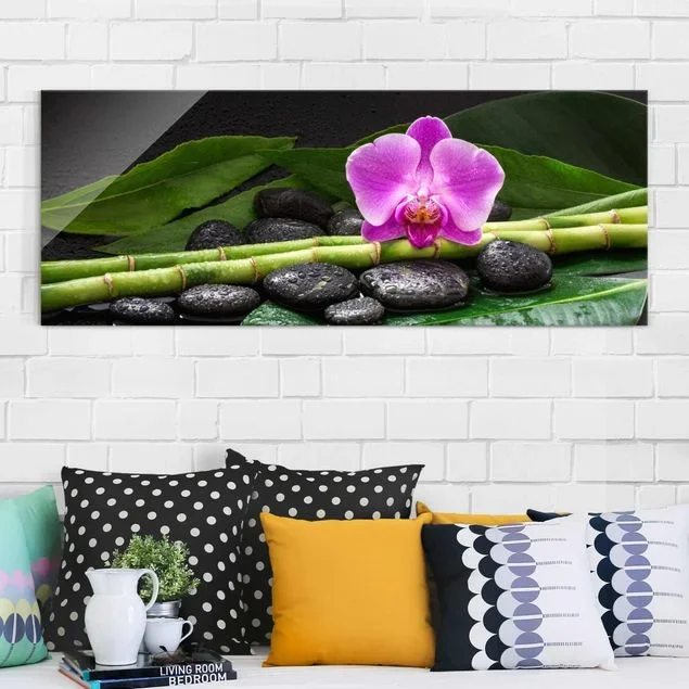 Glasbild Grüner Bambus mit Orchideenblüte